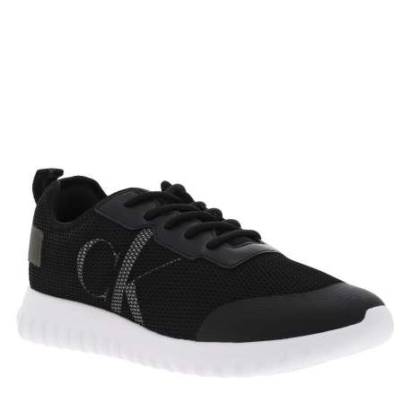 Baskets basses noires à semelle running à talon semi-compensé et tige slip-on