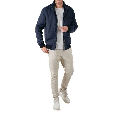 Blouson zippé marine uni avec une coupe droite et un col montant