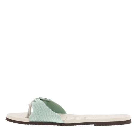 Tongs antidérapantes à entre-doigts liant la sangle beige à lurex du coup-de-pied