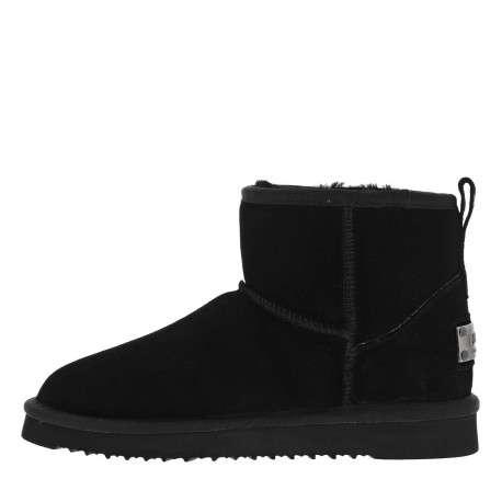 Boots en cuir de vachette noir, fourrées en laine, à semelle plate adhérente