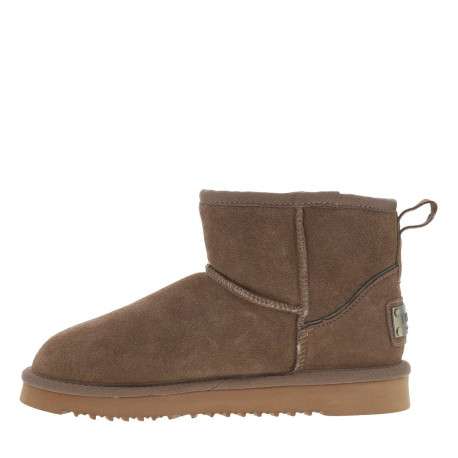 Boots en cuir de vachette beige, fourrées en laine, à semelle plate adhérente