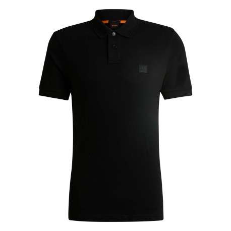 Polo en coton noir uni avec une coupe droite et logo iconique