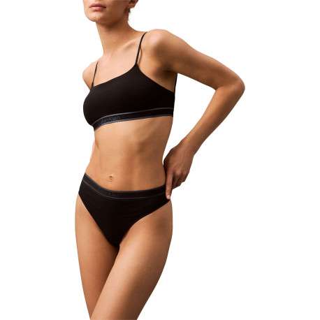 String noir uni avec une taille élastiquée et des liserés sur le haut