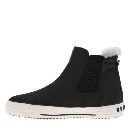 Boots noires à talon plat et à soufflets élastiqués avec col en fourrure