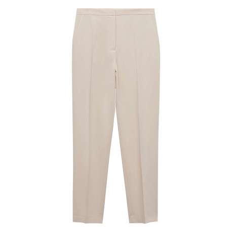 Chino beige uni avec pli marqué et des poches à l'italienne à l'avant