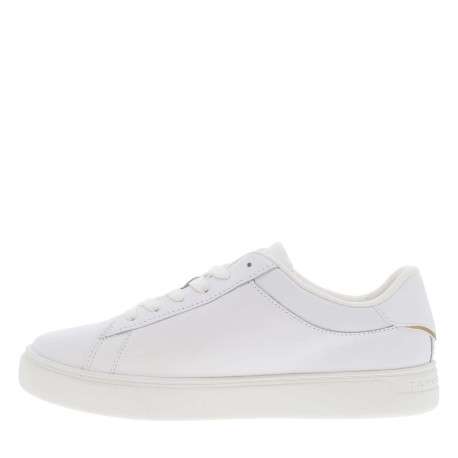 Tennis en cuir blanches à talon plat et à lacets plats avec détail doré