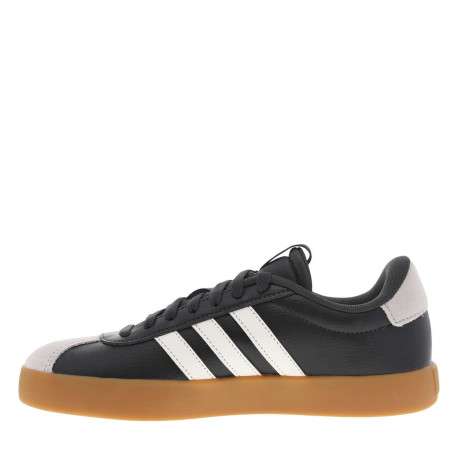 Tennis noires à talon plat et à lacets plats noirs avec bandes blanches