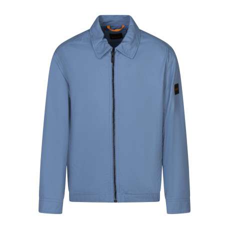 Blouson en coton bleu uni avec une coupe droite et un col à revers