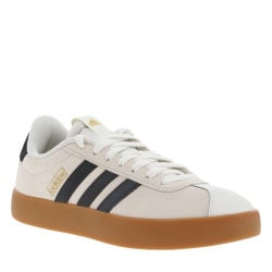Tennis en cuir blanches et noires à semelle marron avec logo doré