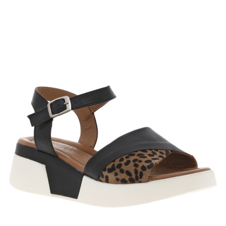 Sandales en cuir noires et blanches à détails léopard et à talon compensé