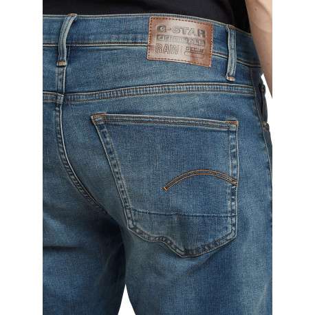 Jean en coton bleu avec une coupe slim et des passants pour ceinture - Image 3