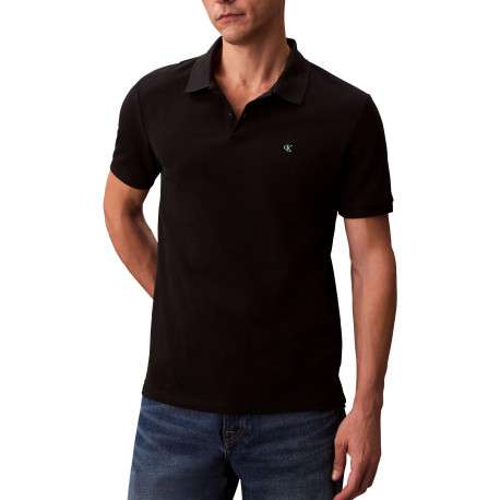 Polo en coton noir uni à coupe slim avec le logo brodé en petit