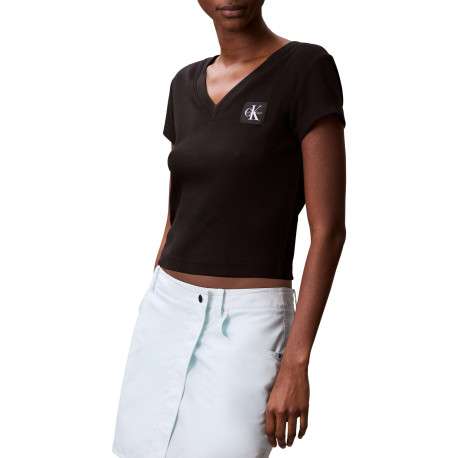 Top en coton noir uni à col v et à coupe courte avec un patch à la poitrine