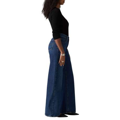 Jean bleu uni avec une coupe bootcut et multiples poches plaquées - Image 4