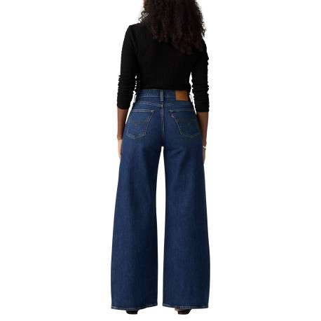 Jean bleu uni avec une coupe bootcut et multiples poches plaquées - Image 5