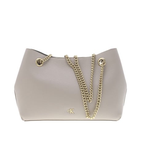 Sac porté épaule beige uni avec logo iconique en doré sur le devant 