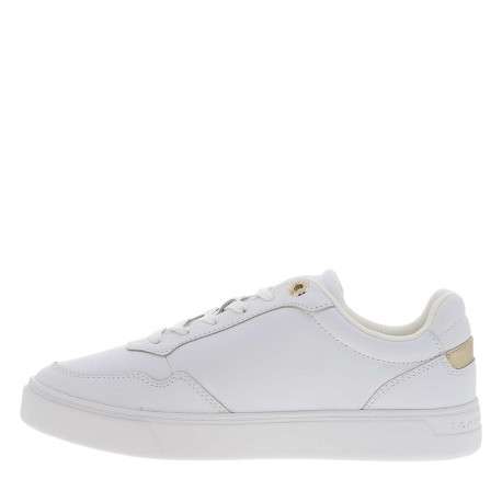 Tennis en cuir blanches avec semelle à talon plat et logos dorés