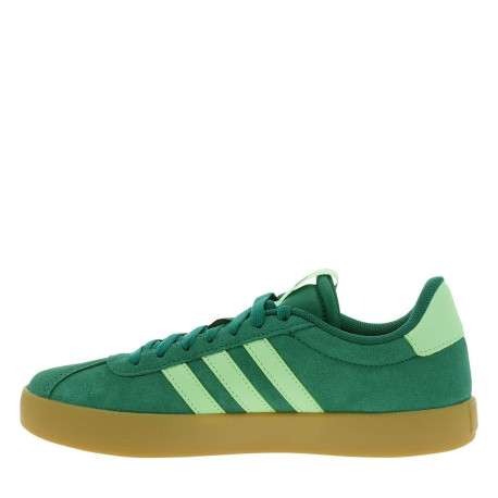 Tennis en croûte de cuir vertes avec semelle à talon plat et lacets