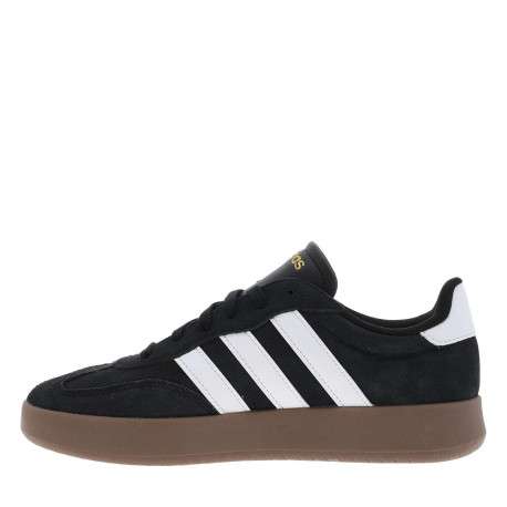 Tennis noires en croûte de cuir avec semelle à talon plat et à lacets