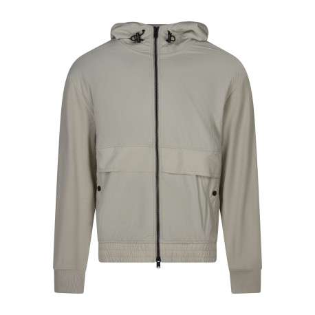 Blouson en coton beige uni avec une coupe droite et une fermeture zippée