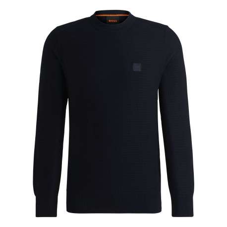 Pull en coton marine pourvu d'un col rond et de manches longues