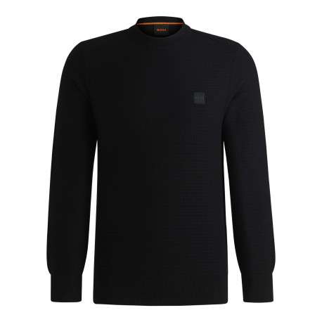 Pull en coton noir pourvu d'un col rond et de manches longues