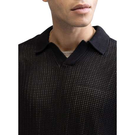 Polo en coton noir uni en maille ajourée avec une coupe droite - Image 3