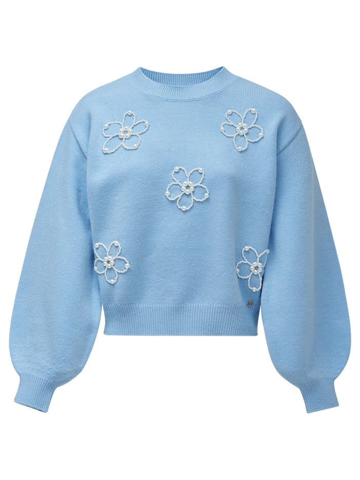 Pull bleu à motifs avec une...