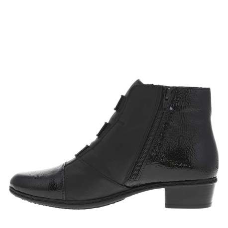Boots en cuir noires à talon décroché bas avec un zip côté interne