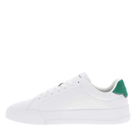 Tennis en cuir blanches et vertes à talon plat avec des lacets