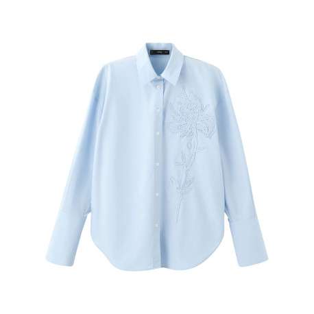 Chemisier bleu ciel uni avec une coupe ample et des manches longues