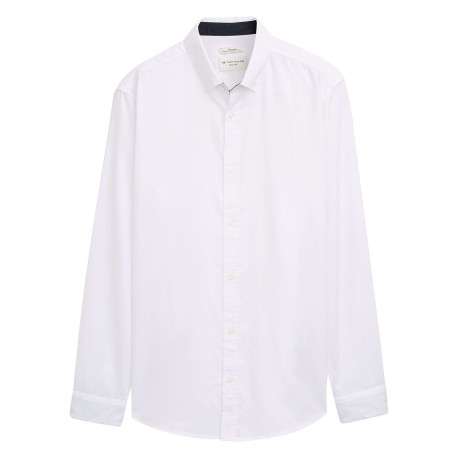 Chemise blanche uni avec un col boutonné et des manches longues
