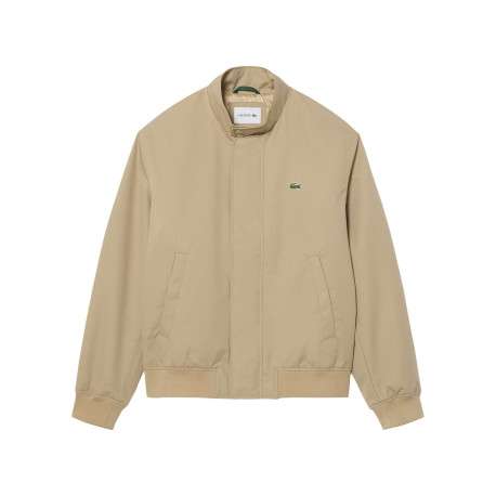 Blouson beige à coupe ajustée pourvu d'un col à boutons pression