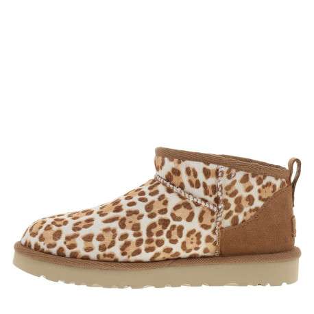Boots en cuir léopard à talon plat avec languette d’aisance à l’arrière