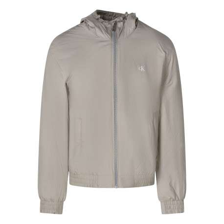 Blouson beige à coupe ajustée pourvu d'un col à capuche avec cordon de serrage