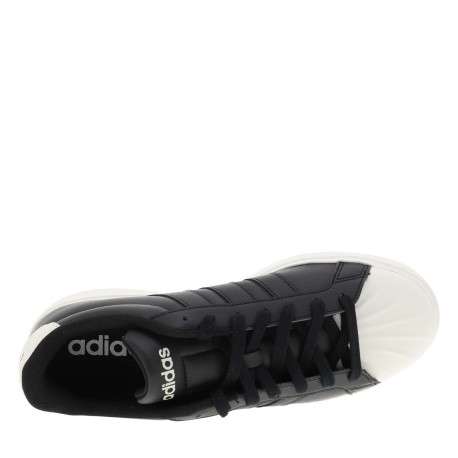 Baskets noires à talon plat avec des lacets et une semelle blanche - Image 4