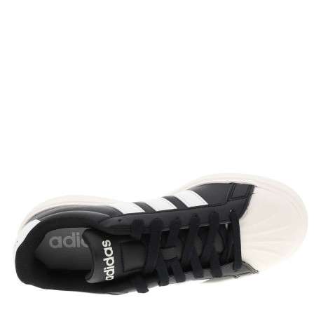 Baskets tennis noires et blanches avec un talon plat et des lacets - Image 4