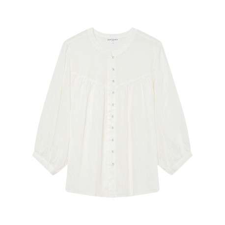 Blouse blanche unie avec une coupe droite et un col rond et des boutons