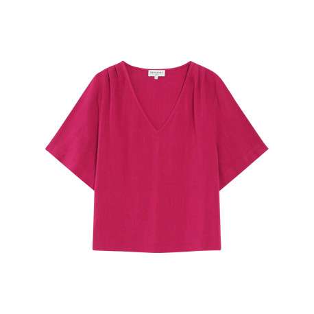 Top rose uni fluide avec une coupe large et des manches courtes