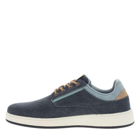 Basket basse bleu marine à talon plat avec un patch sur la languette