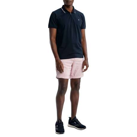 Polo en coton marine uni pourvu d'un col zippé et de manches courtes