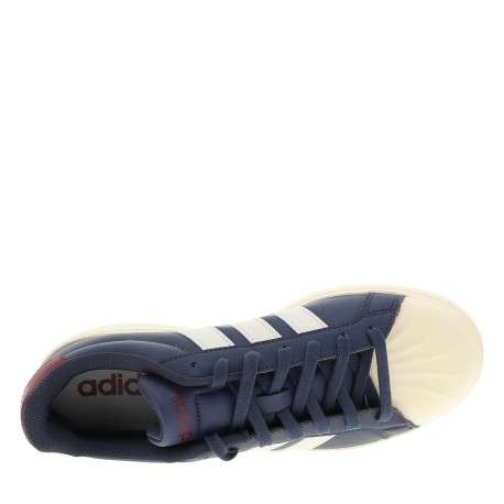 Baskets bleues avec un talon plat pourvu de lacets et de bandes blanches - Image 4