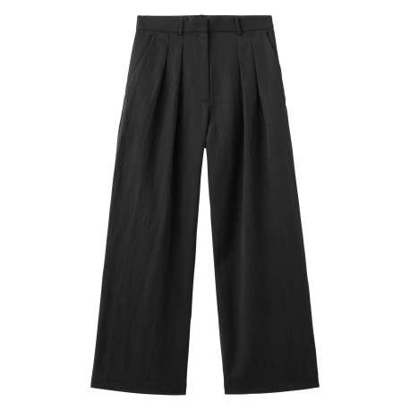 Pantalon noir uni pourvu d'une coupe large et de passants pour la ceinture