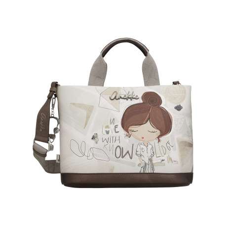 Sac porté main écru imprimé avec un imprimé de la marque sur le pourtour