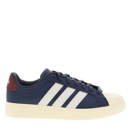 Baskets bleues avec un talon plat pourvu de lacets et de bandes blanches - Image 2