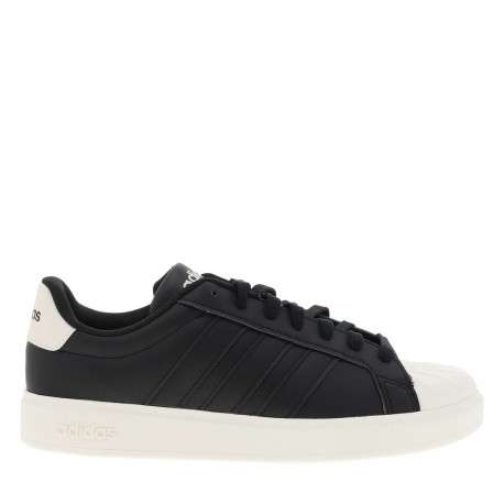 Baskets noires à talon plat avec des lacets et une semelle blanche - Image 2
