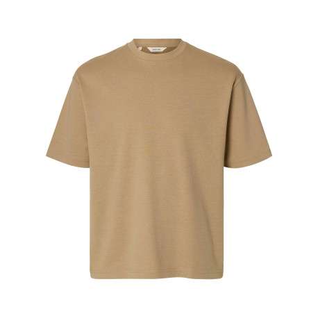 T-shirt beige uni coupe ample avec un col rond et des manches courtes