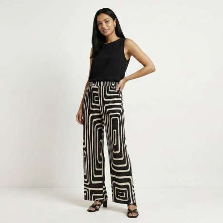 Pantalon écru et noir plissé pourvu d'un motif géométrique et d'une coupe ample - Image 4