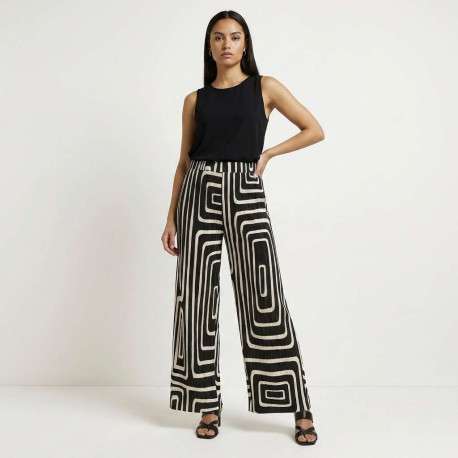 Pantalon écru et noir plissé pourvu d'un motif géométrique et d'une coupe ample - Image 5