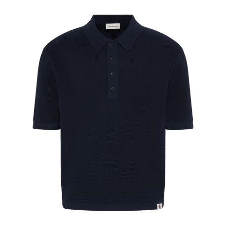 Polo en coton marine uni avec une coupe droite et un col à revers